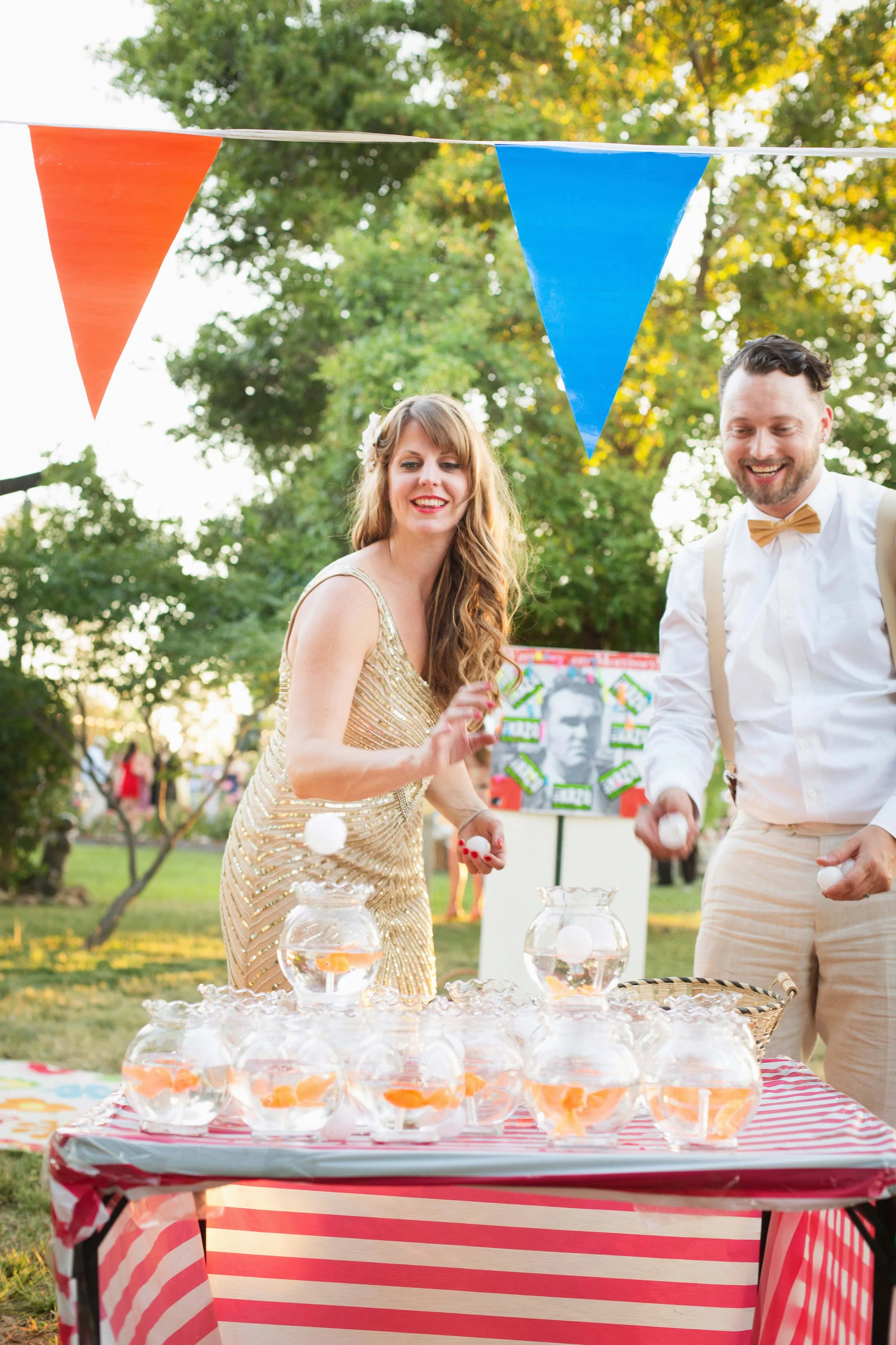 bride and groom play carnival games at wedding reception in Sacramento