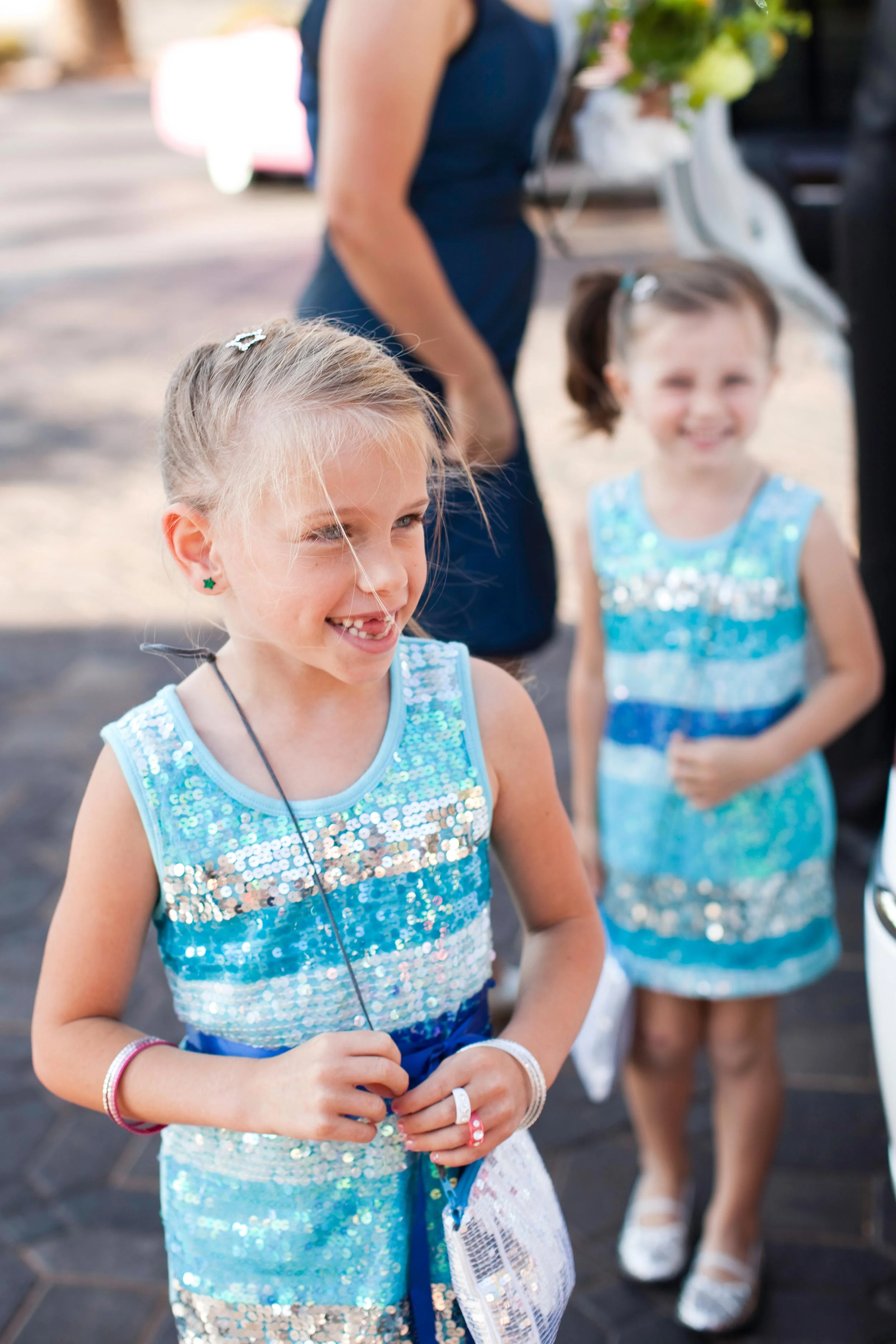 Flower girls wearing blue sequined dresses at Viva Las Vegas Wedding chapel