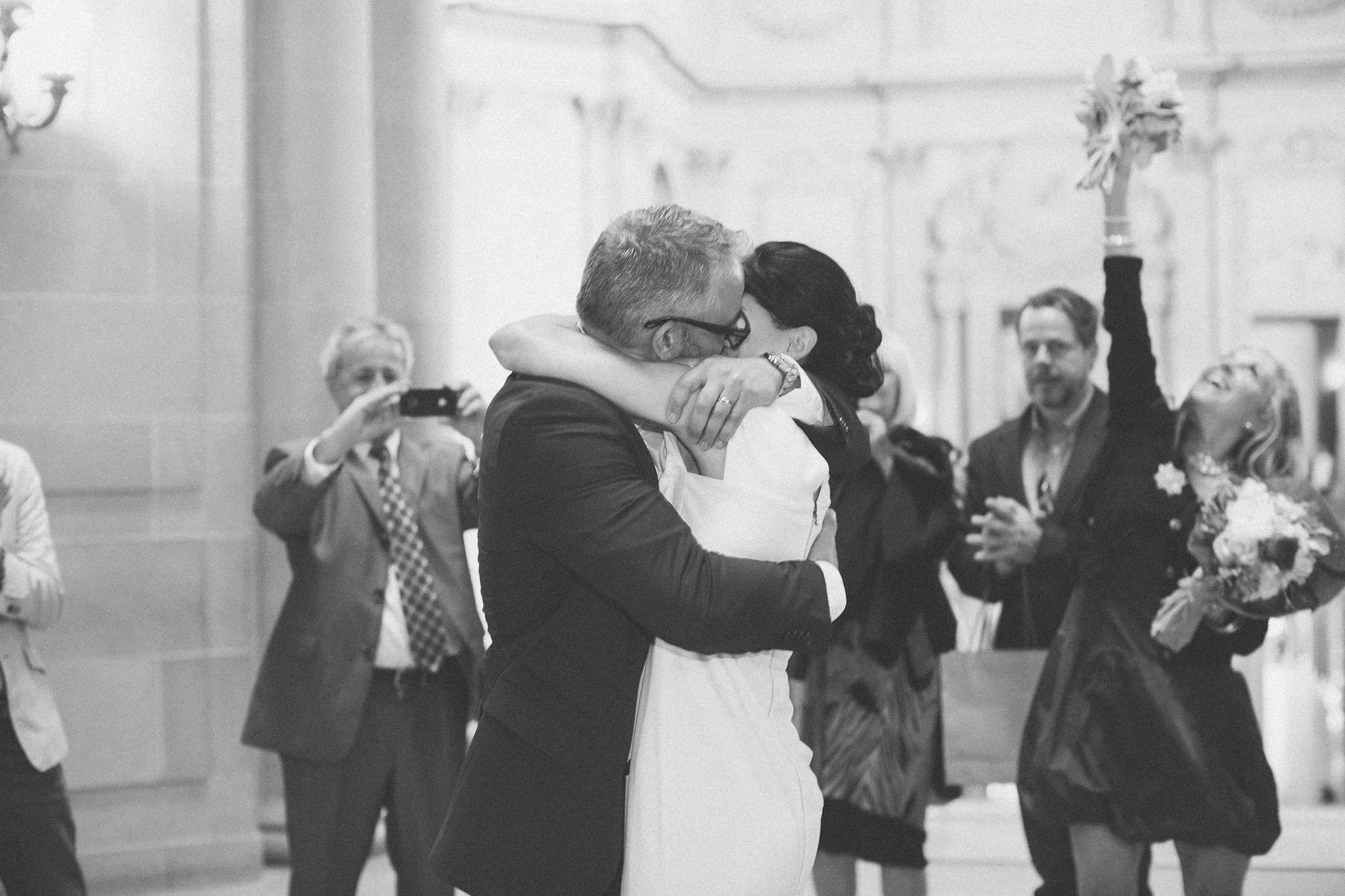 san francisco city hall wedding ceremony kiss under rotunda