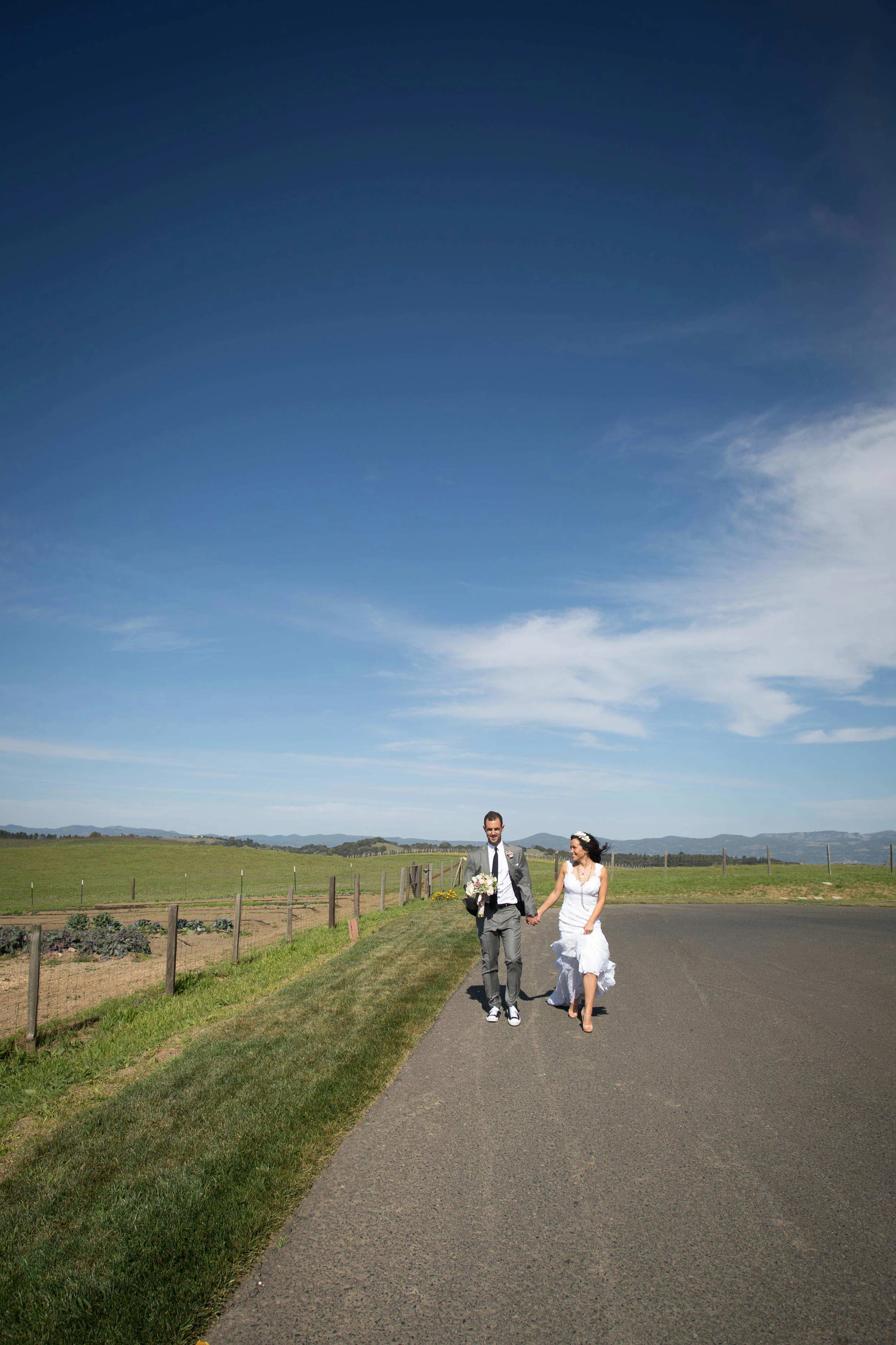 Bride and groom walking at the Carneros Inn