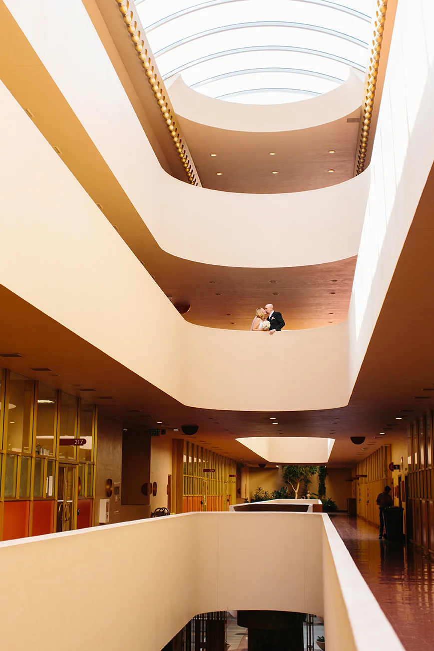 Absolutely stunning Frank Lloyd Wright architecture! Laura and Nick enjoy a kiss on the balcony.