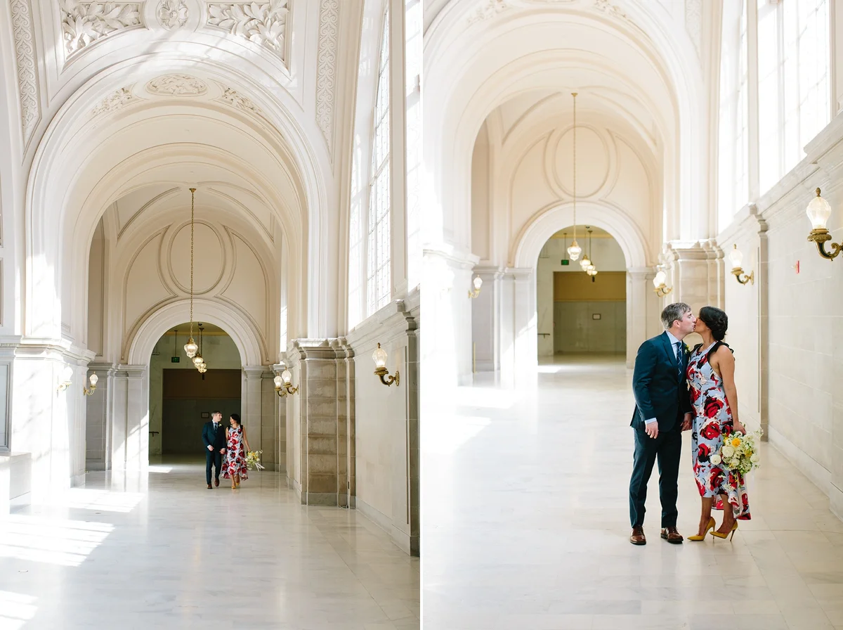 The bride and groom walk underneath the classic arches of San Francisco City Hall.