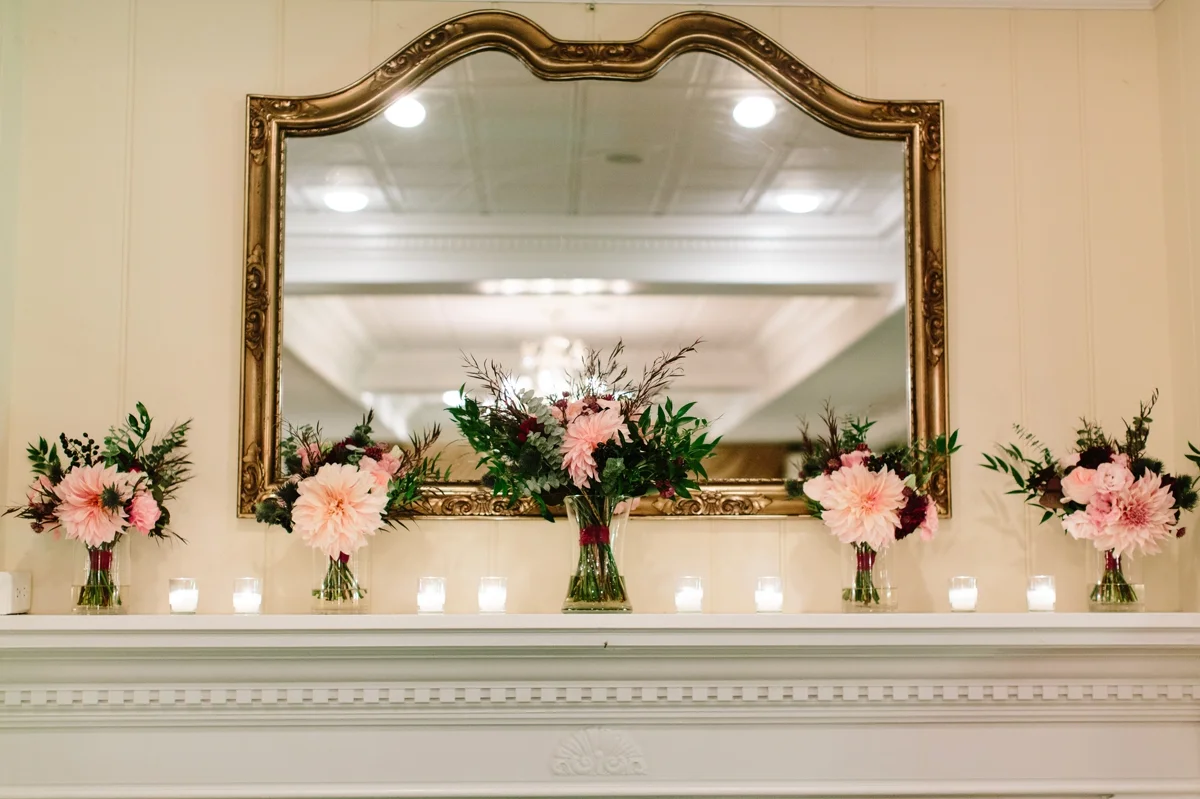All the bridal bouquets on the mantle during the wedding reception at Washington Crossing Inn.