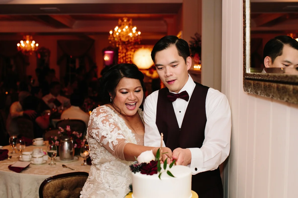 Bride and groom cut the cake at their wedding at the Washington Crossing Inn.