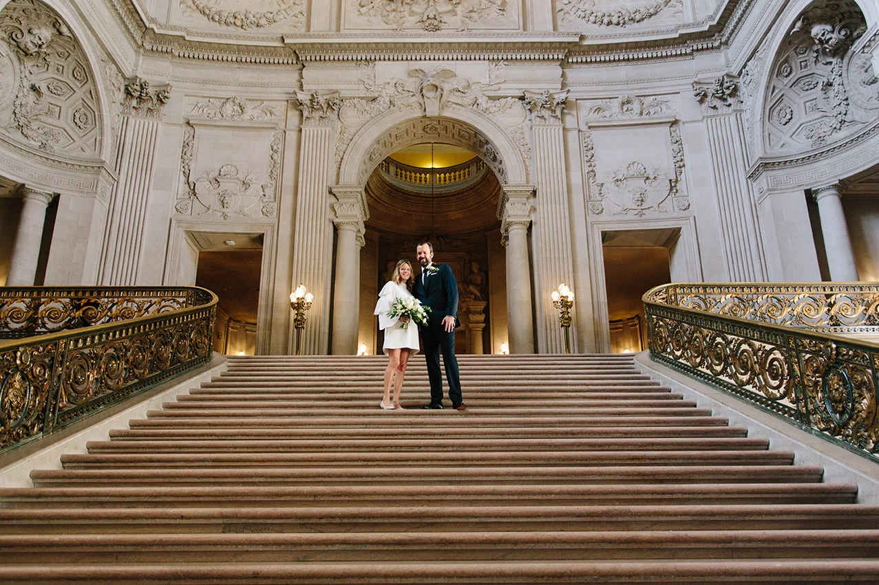 Bride_and_groom_on_GrandStaircase_SanFrancisco_CityHall.jpg