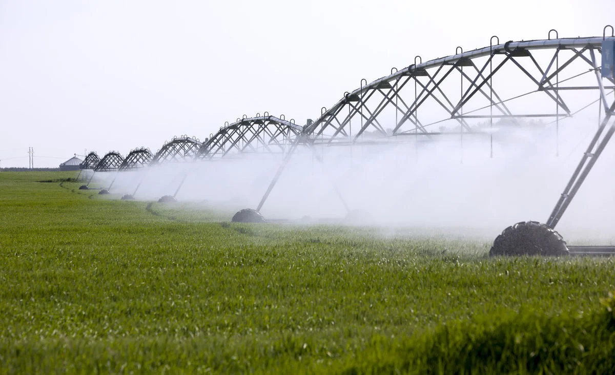 High-capacity wells that have been linked to lower surface water are the source of water for irrigation systems like this one watering a cornfield in Waushara County.