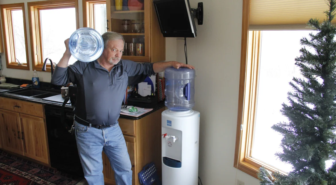 Frank Michna buys bottled water for drinking and cooking in his Caledonia home because of high levels of molybdenum and boron in his well.