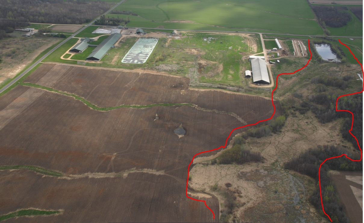   Aerial view of manure spill (inside red lines)  