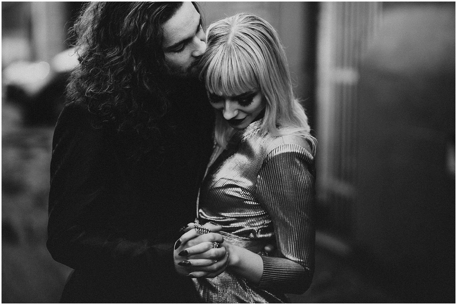  Vancouver gastown city black and white love cuddle embrace hand holding interlocked fingers engagement couple session metallic shiny blunt bangs curly hair beautiful man woman fingernails manicure style&nbsp; 