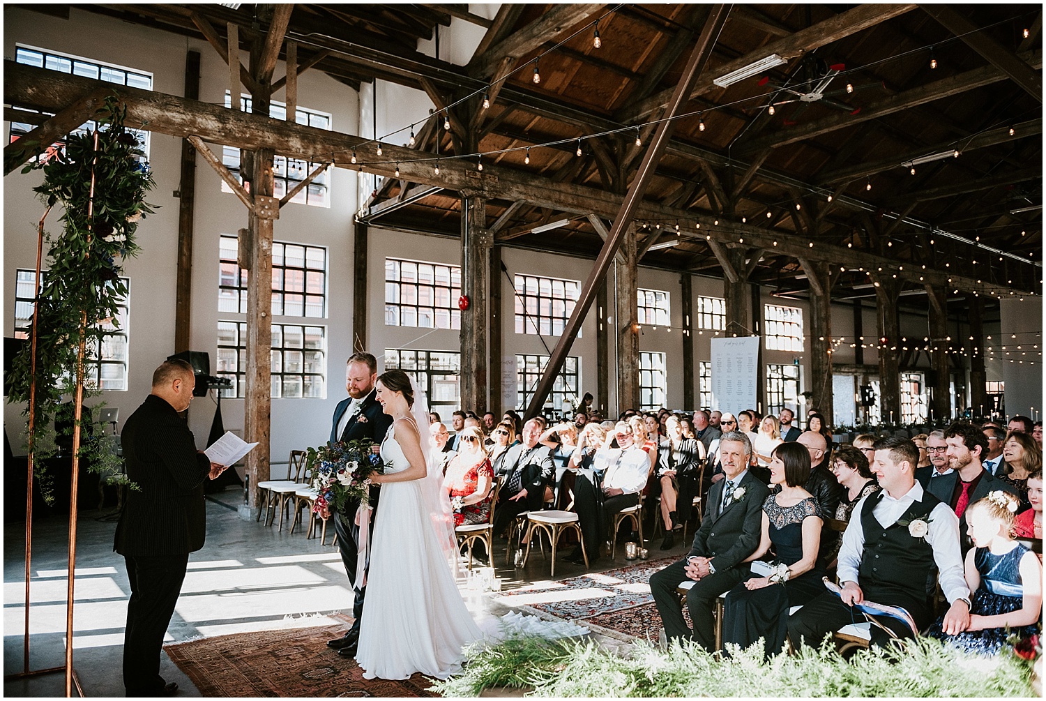 wooden chairs ceremony wedding decor diy bride unique greenery boho chic north vancouver intimate wedding stacie carr photography pipe shop venue