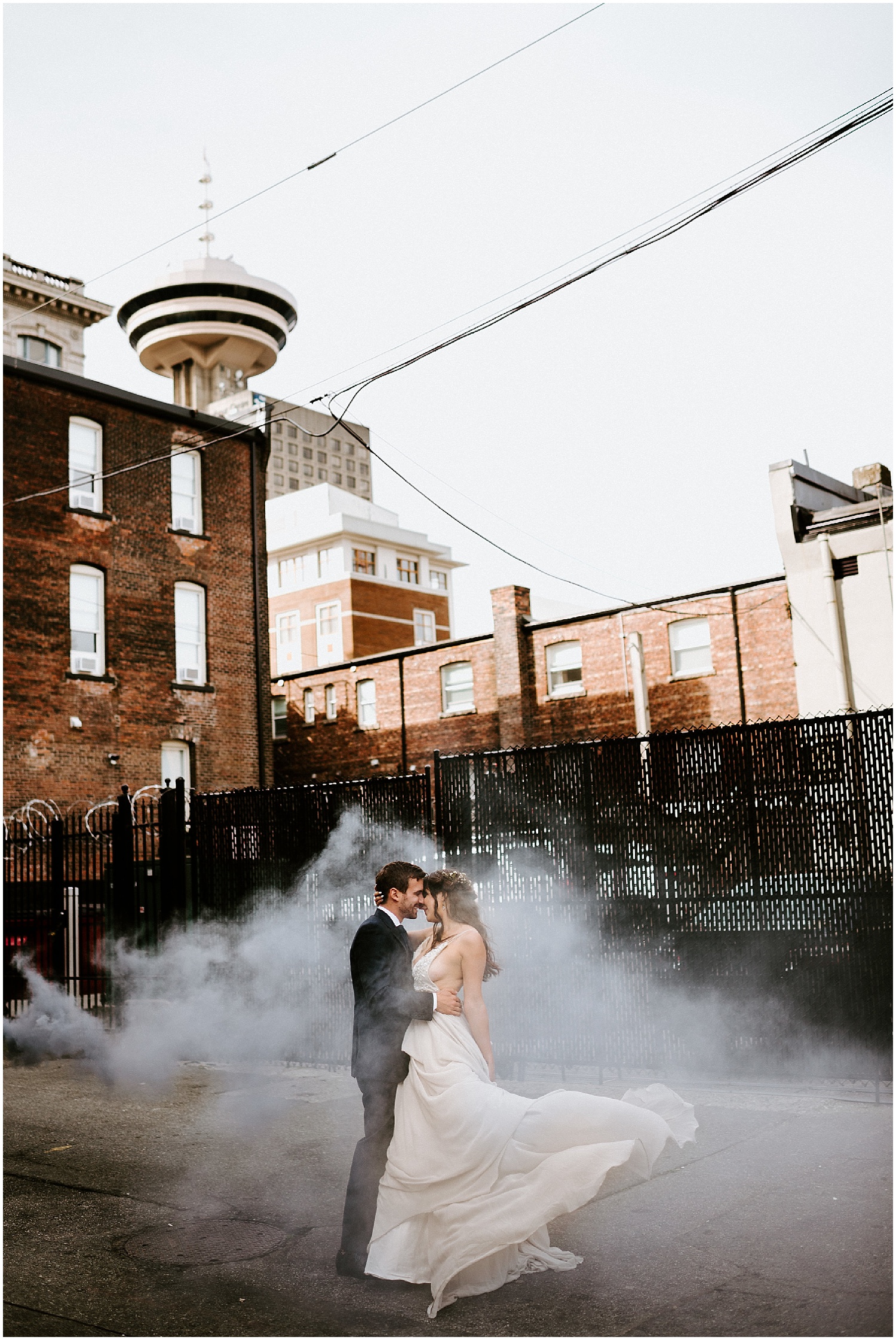 downtown vancouver urban wedding photo back alley couple manhole steam