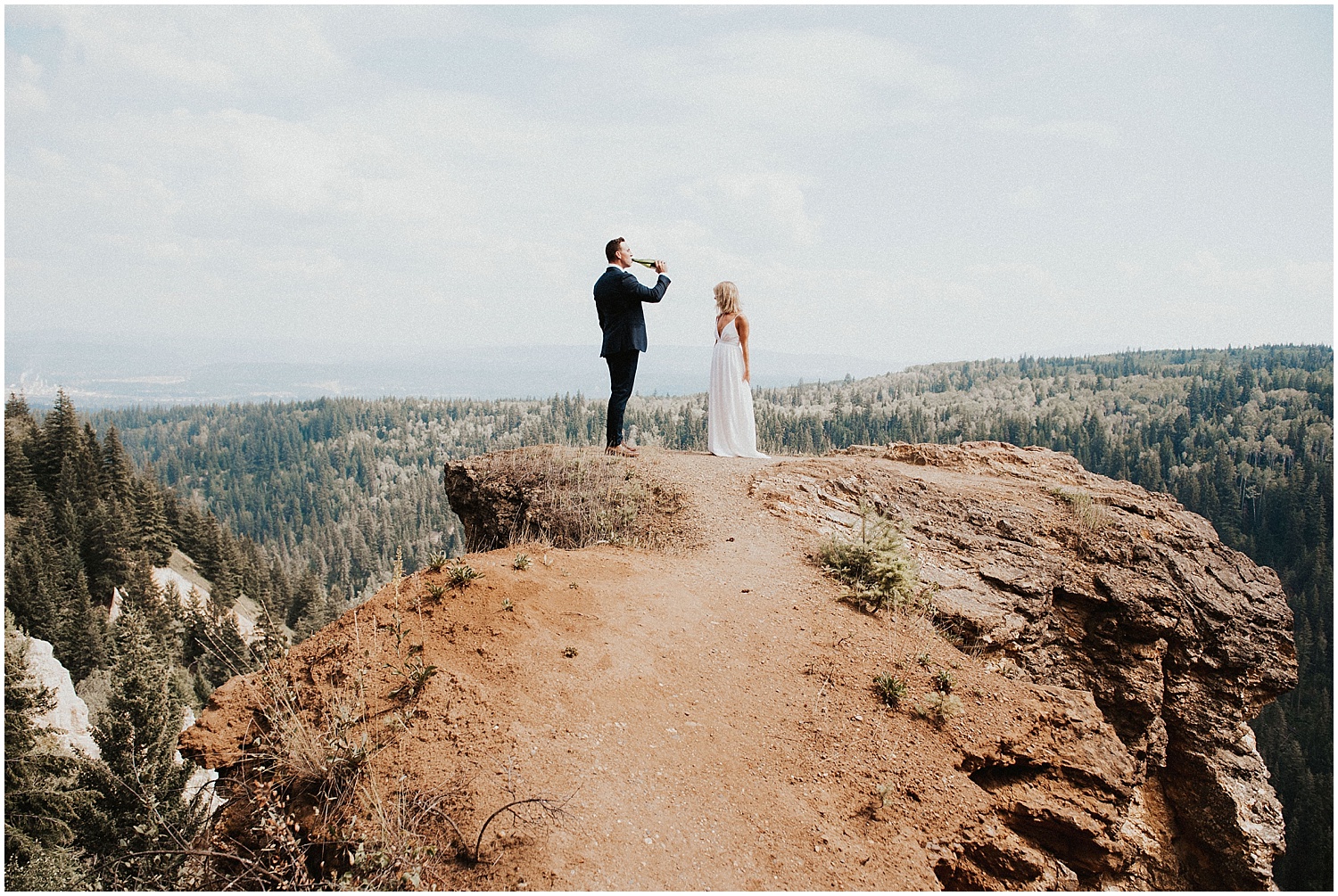  bc wedding photographer quesnel couple popping champagne fun photography pinnacles park lookout point 