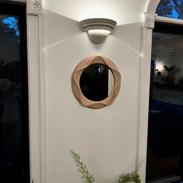 We absolutely love the beautiful and very unique wooden mirror. It is obvious that it is a custom piece and it really adds nice modern character to out great room. Thank you Bob.webp