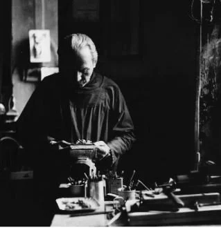 Alfieri looking down in his art studio