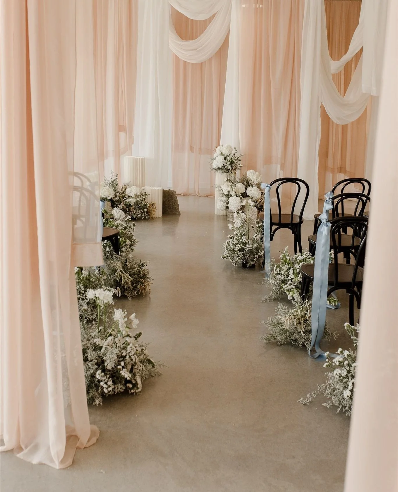 Design notes from the ceremony of an editorial from last spring, as featured on my blog today.⁠
⁠
Layered and multi-tonal draping, a curved aisle, and an organic focal feature at the front were the pieces that came together to really make this ceremo