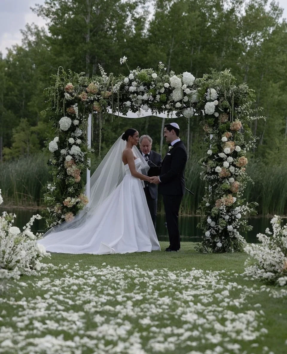 For Lindsay and Michael's wedding, our goal was maximalist design features, with the chuppah and aisle being the primary focus. We aimed for a somewhat modern European luxury feel, within that monochromatic whites and greens. ⁠
⁠
I'm kicking off this