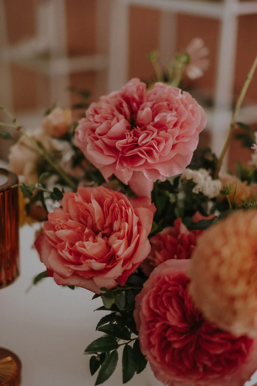 Closeup of Coral Garden Roses in a Wedding Centrepiece