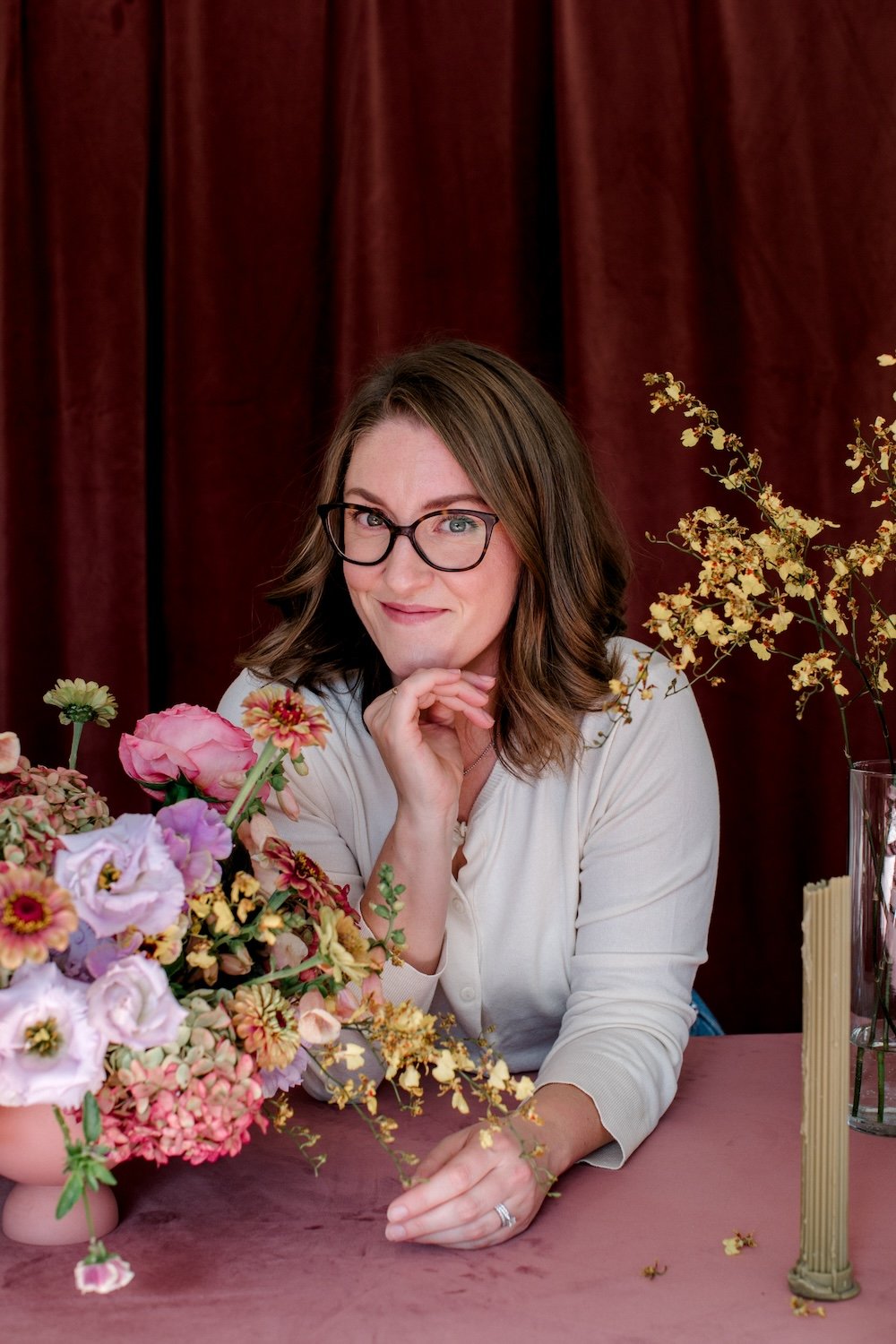 Headshot of Winnipeg Wedding florist, surrounded by flowers