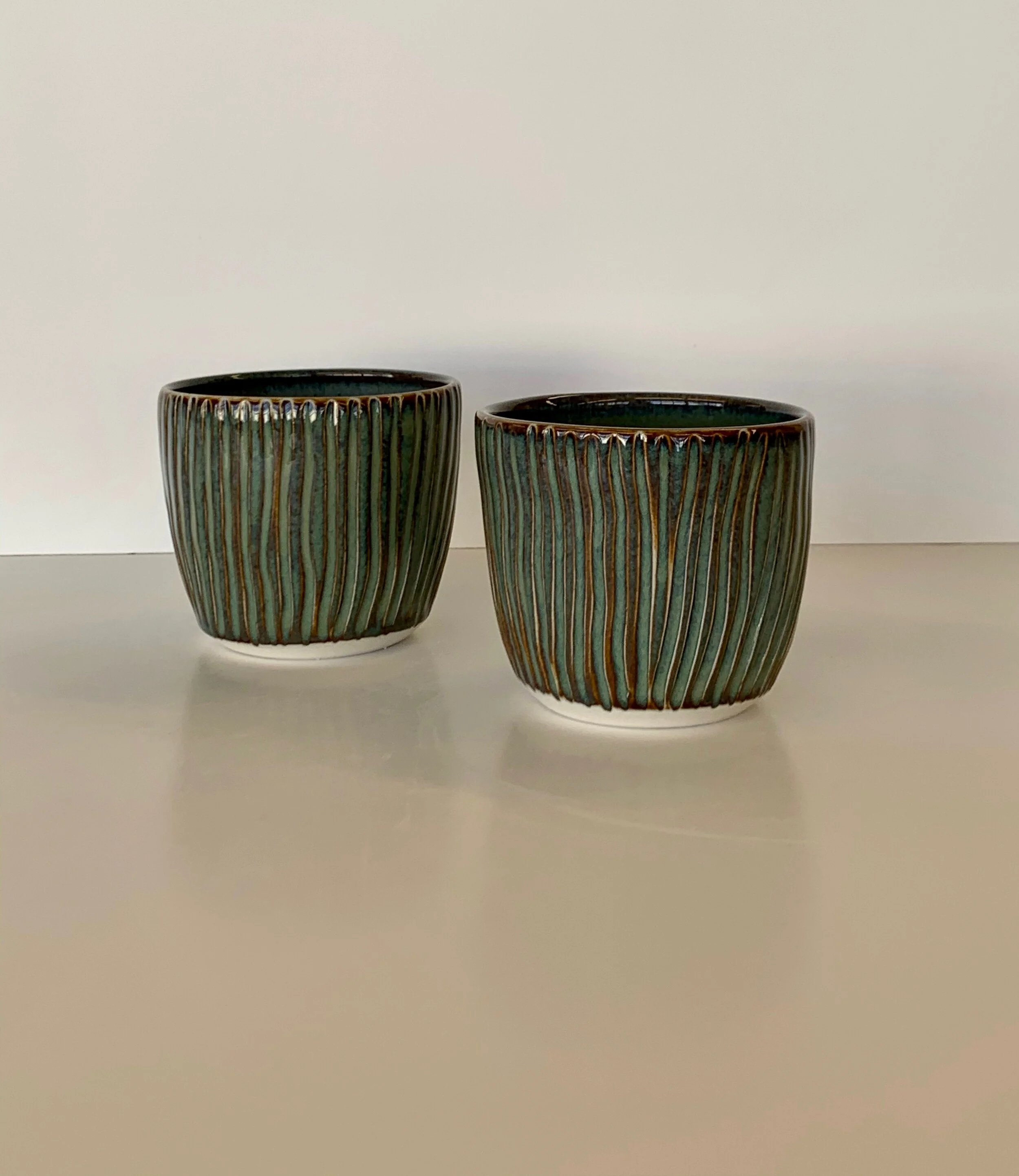 Grooved floating blue porcelain tea cups