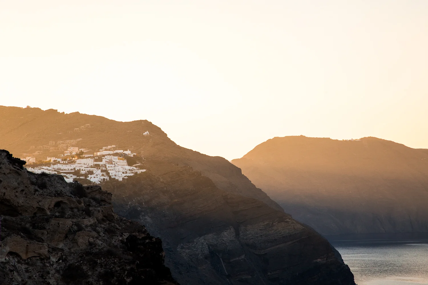 Santorini Cliffs Sunrise Rays-1.jpg
