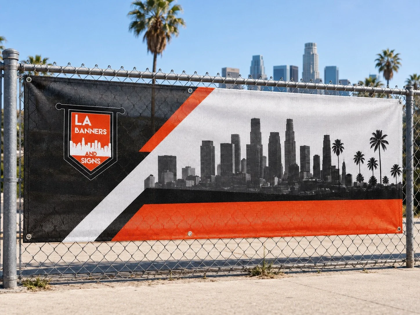 Mesh banner installed on an outdoor fence