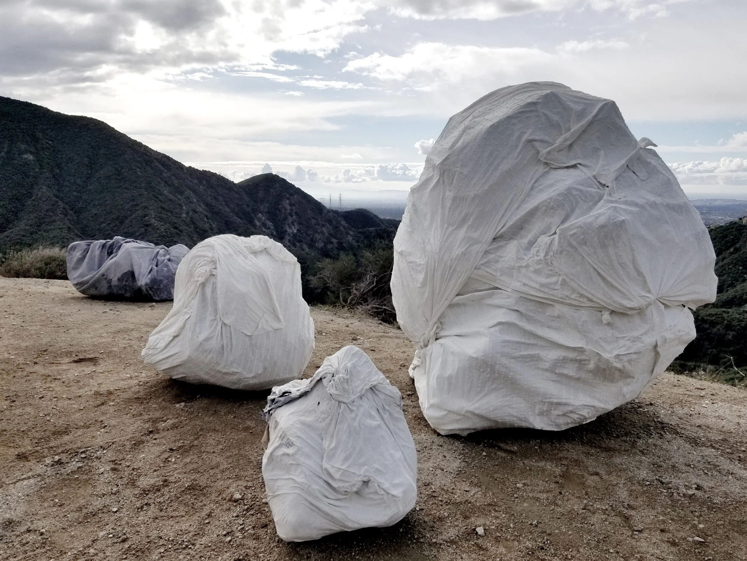 Travelers Bundles, Various, 2022 Polystyrene, Curtains + Lime Plaster