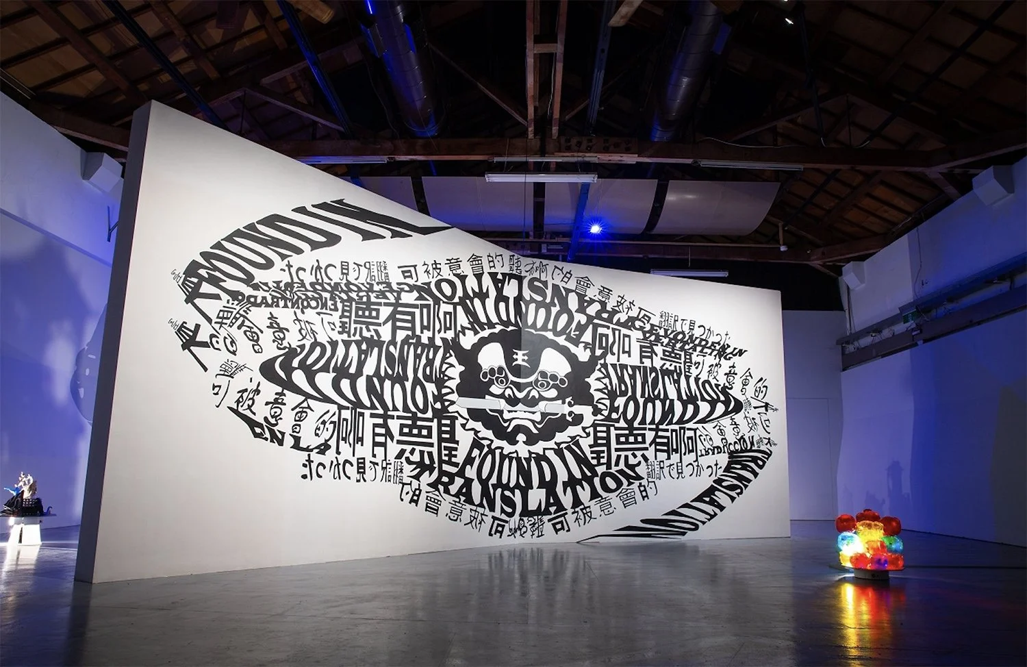    Polyglots (Atmoshperes of Influence)  , 2023, installation, murals, Taiwanese souvenirs, rotating motors, shadows, Sia-long, Jaili, Taiwan, dimensions variable 