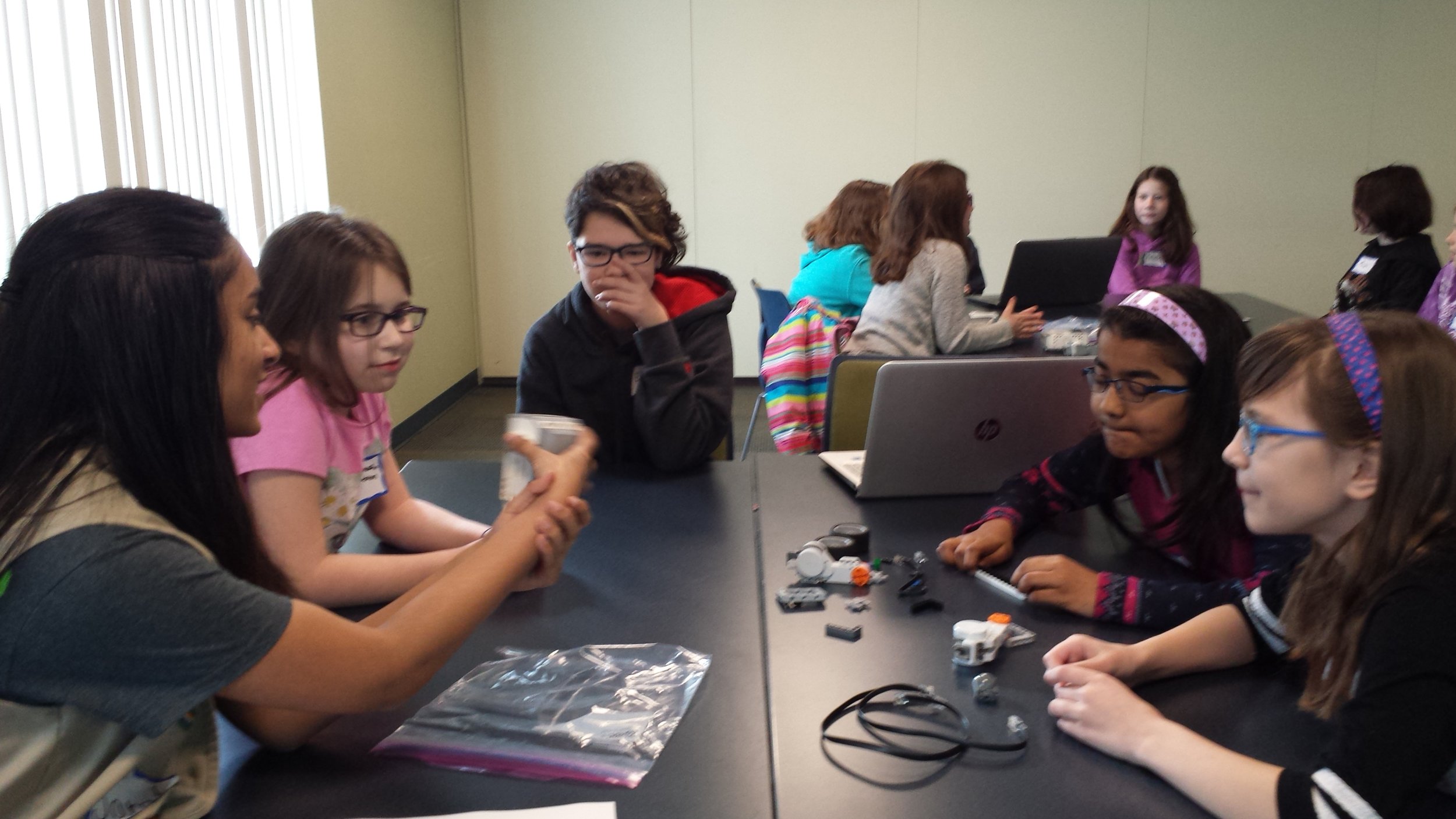 Sarah explains the different components of a Lego Mindstorms robot. Girls Robotics Camp, March 2017.