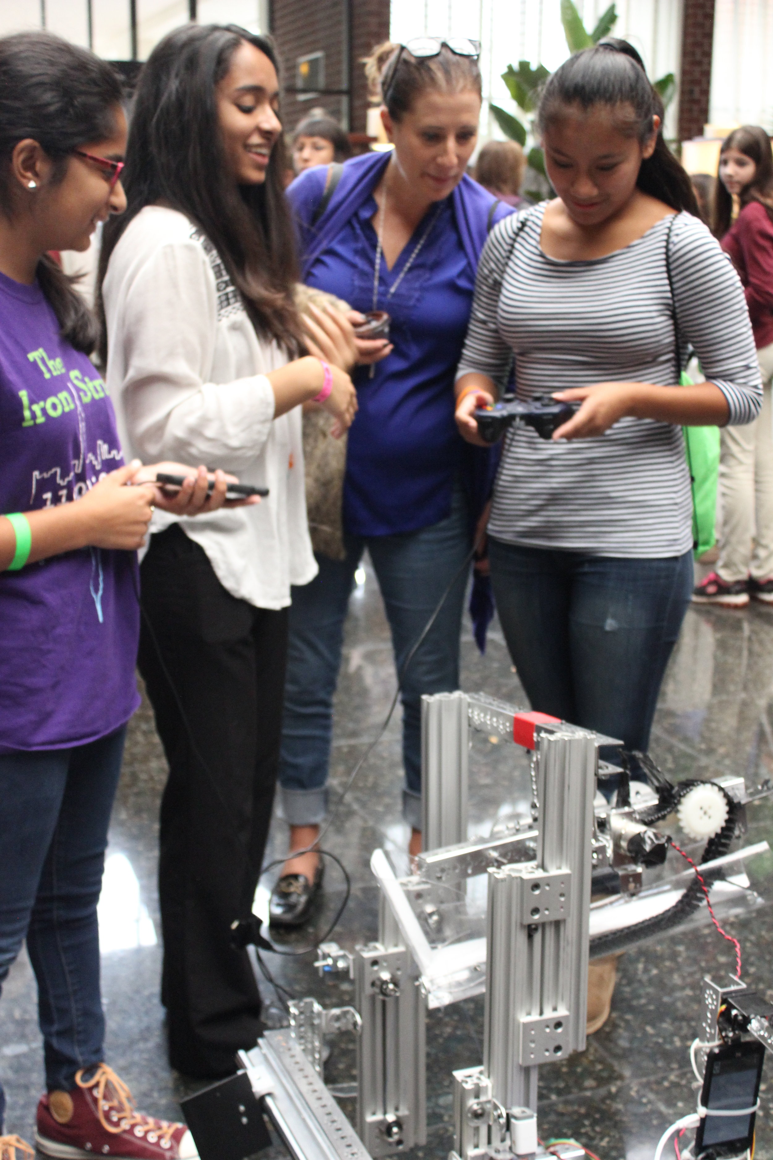  Sarah and Susan help girls drive the robot. Girls World Expo, October 2016. 