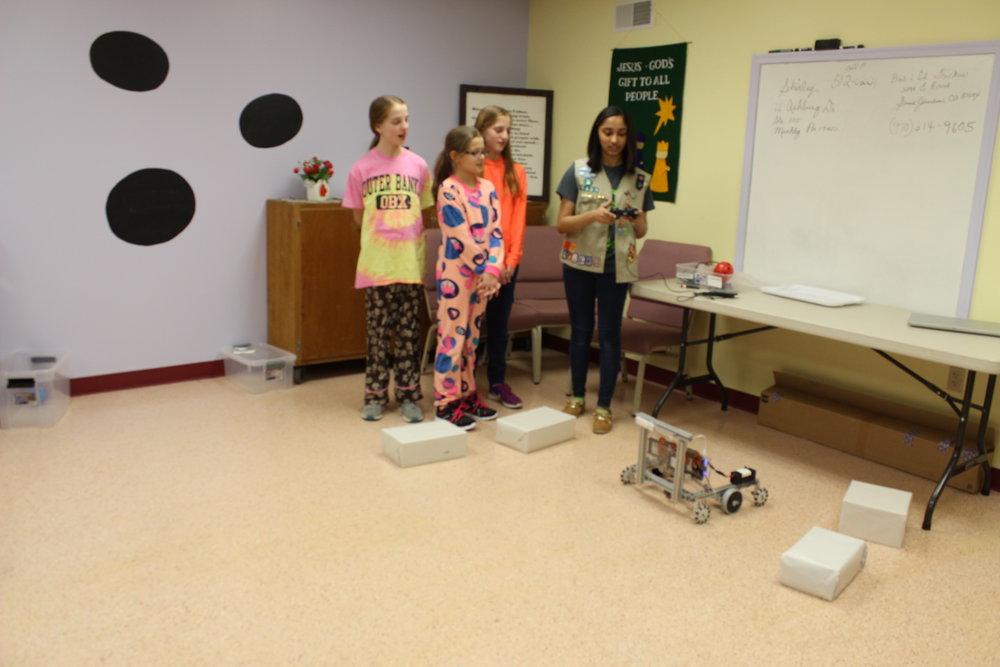  Rachael helps Girl Scouts with driving the robot. Girl Scout Lock-in Outreach, February 2017. 