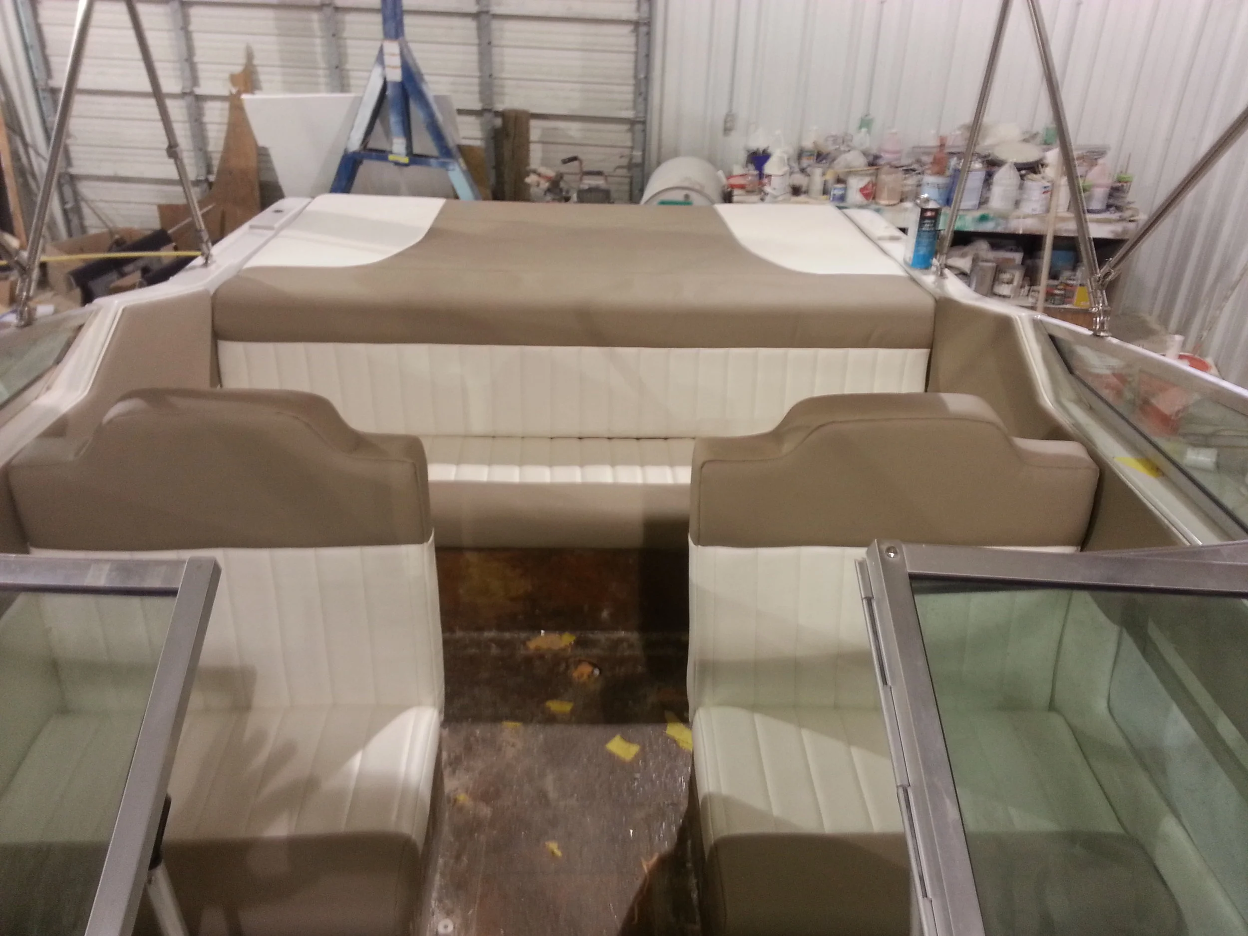 Custom marine interior provided by https://www.sunbrella.com/en-us/, diamond tucked seats, custom auto and marine upholstery and interior in michigan, ohio, canada Vinyl sewing design jet ski interior, wave runner interior and canvas bimini top