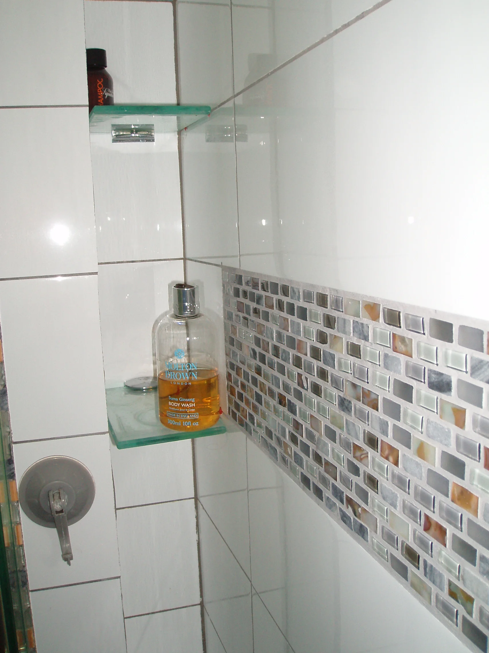  This niche was designed to hold bottles inside the shower but cannot be seen by anywhere else in the bathroom other than inside the shower. 