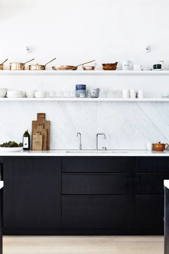 The strength of black is often emphasised by using it with white. Checkered tiles are a classic example and white marble is a more current example. image via myscandinavianhome.com