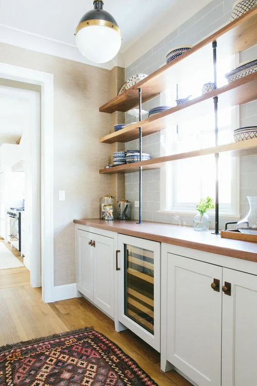 Another way to incorporate a window in your pantry design is to simply shelve over it. Maximum light and maximum storage space. | designed by Kate Marker Interiors
