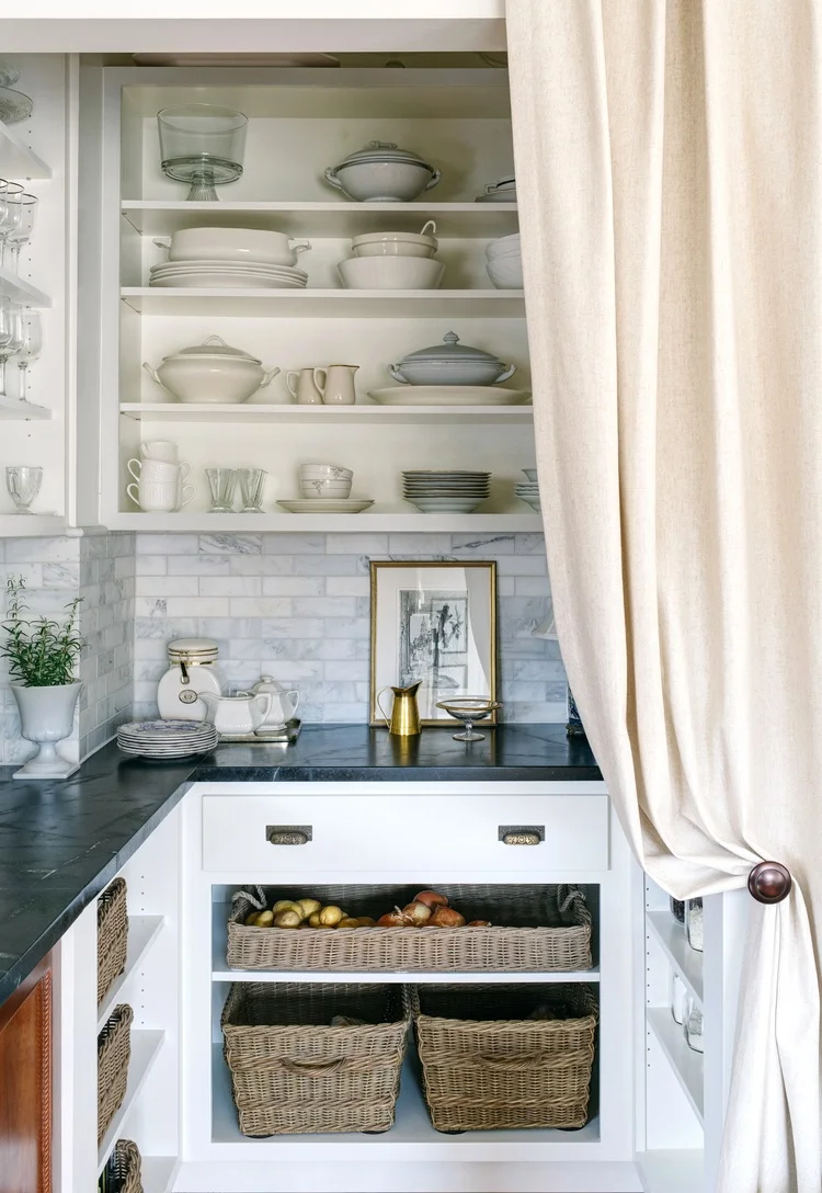 A stylish way to use a curtain as a door. The fabric drapes nicely and softens the look. | Sandy Maruca Design | source