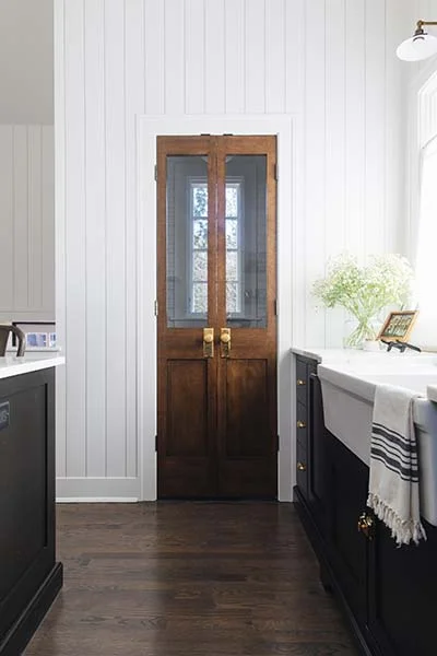 Antique doors in a fresh new kitchen, stunning. | designed by: reDesign Home