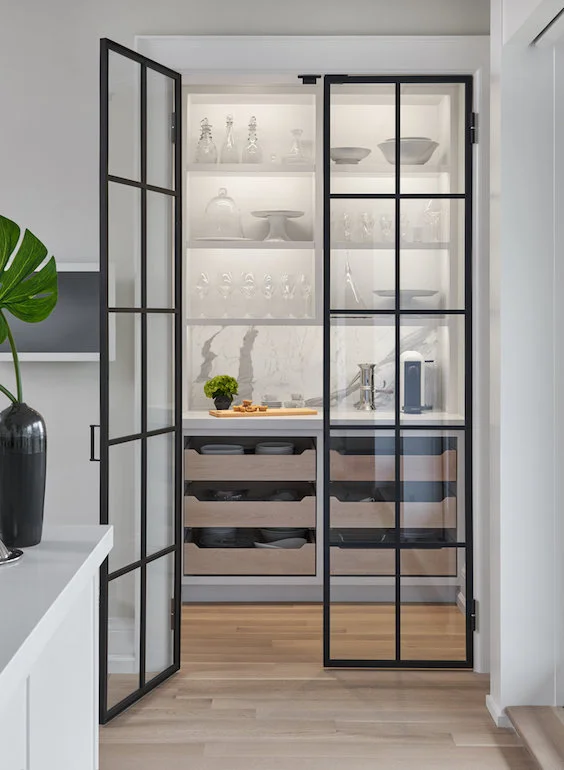 Another beautiful entrance to a butlers pantry. This one is more of a showcase of what's inside, the marble and crockery pieces. It’s all lit up like a pretty jewelry box. | interior designer: Rachel Deeks Design