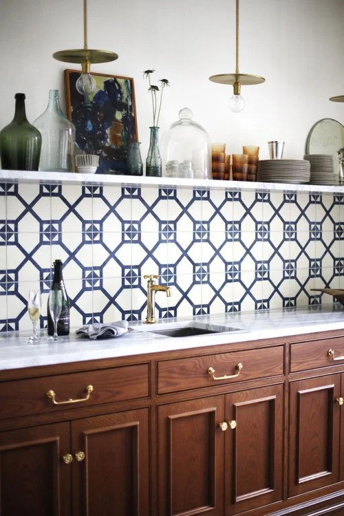 Geometric patterned, navy and white tiles. The mix of modern and traditional is very well done in this drinks / sideboard area. Interior designer: Katie Hackworth