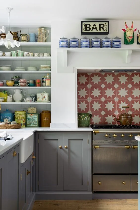 Playful red and white star tiles in this British kitchen by deVOL . They’re Spanish encaustic tiles made with natural pigments.
