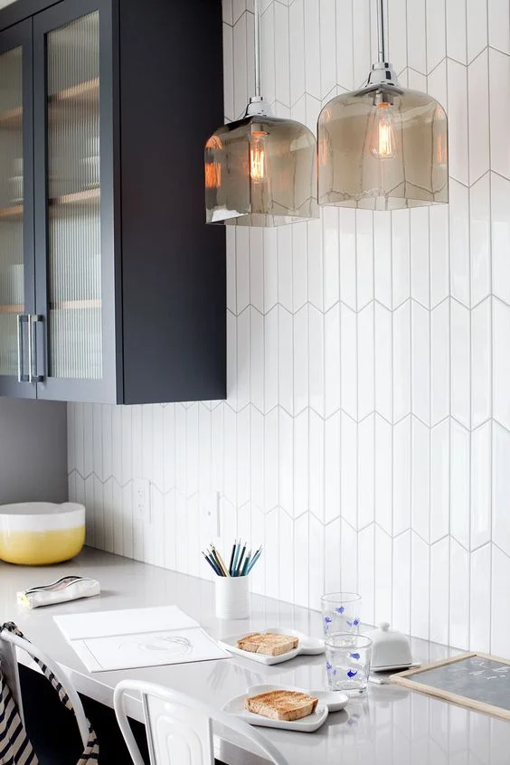 White geometric tiles are never boring. Interior design by HGTV personality Jillian Harris