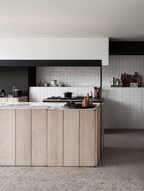 Luxe and rustic kitchen featuring handmade tiles laid in a simple grid pattern. Interior Architects: Frederic Kielemoes and Vanessa Cauwe