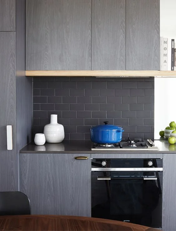 North Fitzroy, Graphite Apartments that embody urban style living. Matte black subway tile, brick bond layout. Interior Design: Mim Design