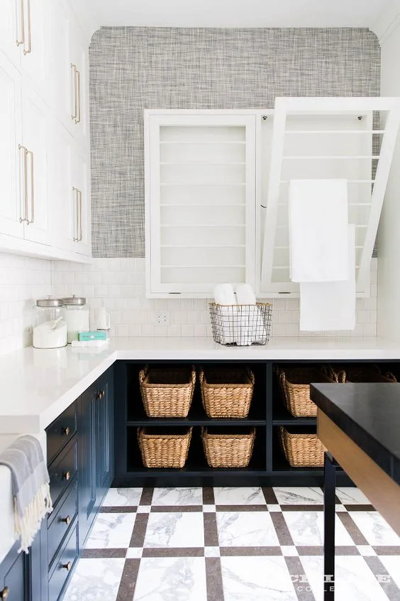 A classy laundry room with everything you’ll ever need, including a tilt out drying rack. | Alice Lane Home