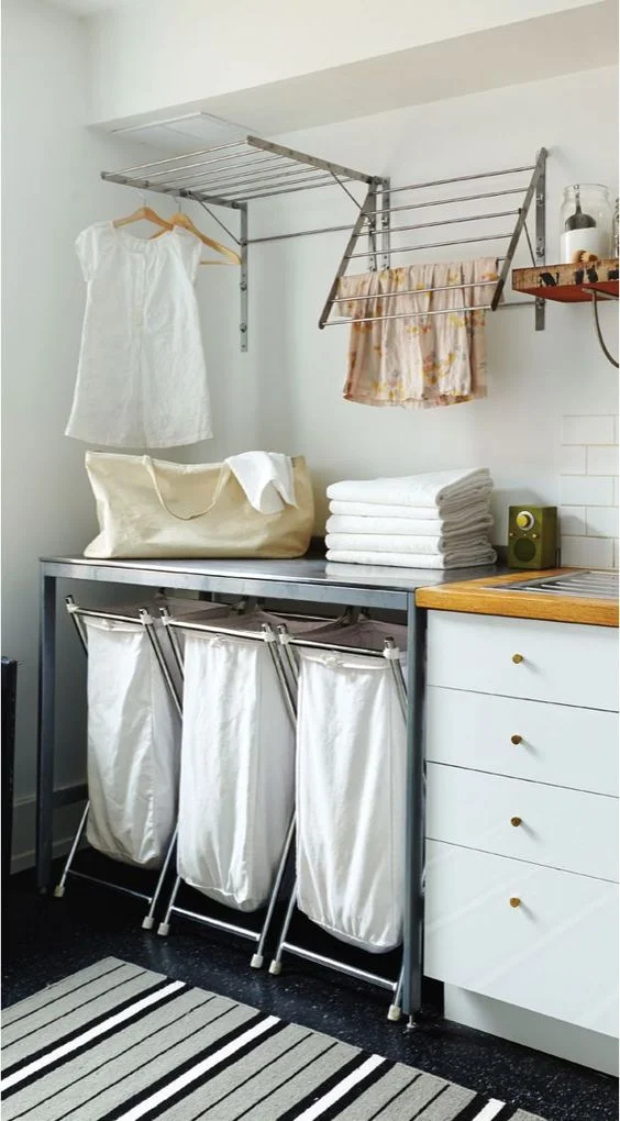 Stainless steel dryer racks are great for either using hangers or just using the bars to hang clothes to dry. The hanging washing bags are great too. | Ikea
