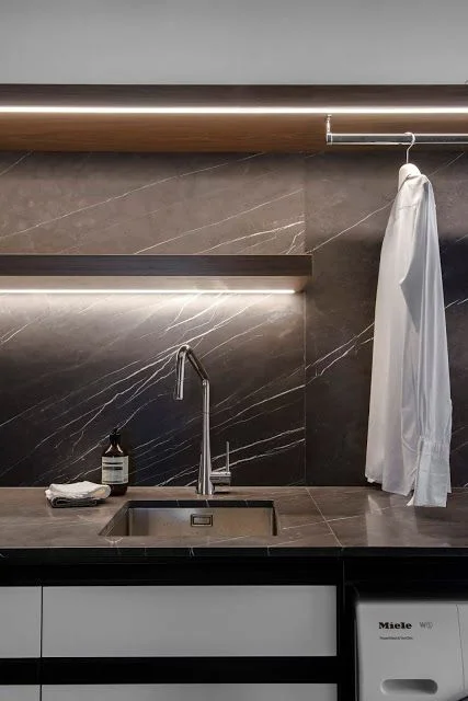 A laundry with moody colour palette and glorious strip lighting. | Minosa Design