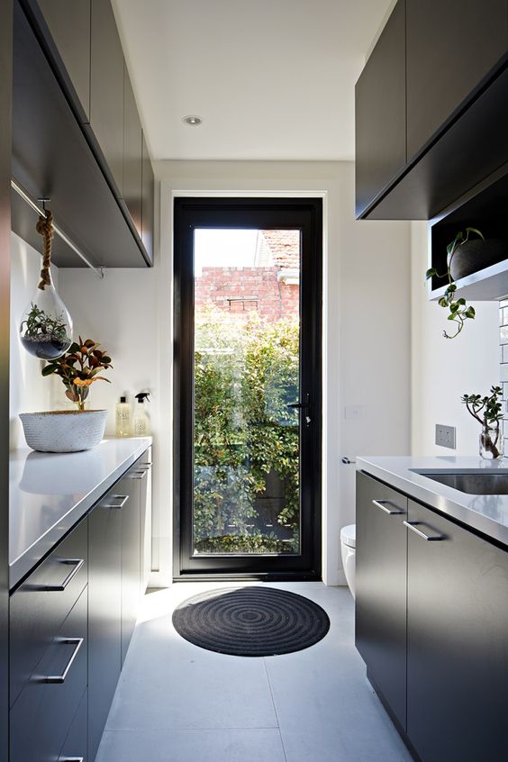I adore the use of plants in this laundry, especially the terrarium hanging from the clothes rail! | Archiblox