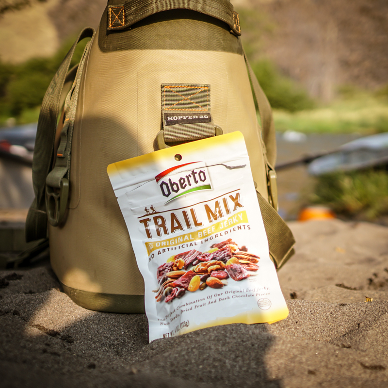 Trail Mix with Jerky resting against a Yeti cooler 