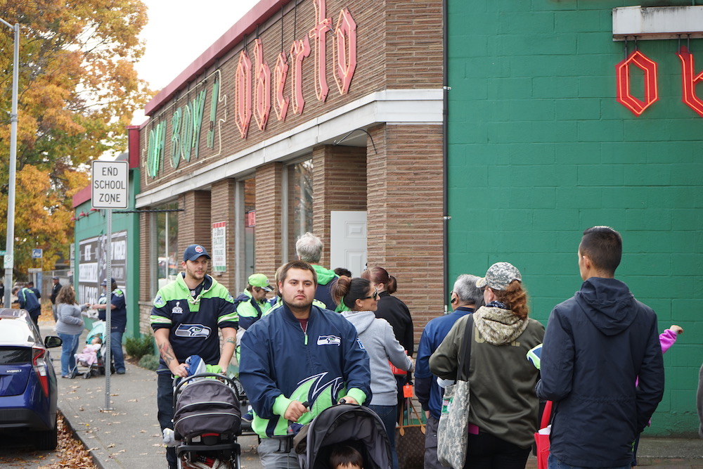Fans standing in line our Rainer location at the Oberto 100 year anniversary celebration with Bobby Wagner