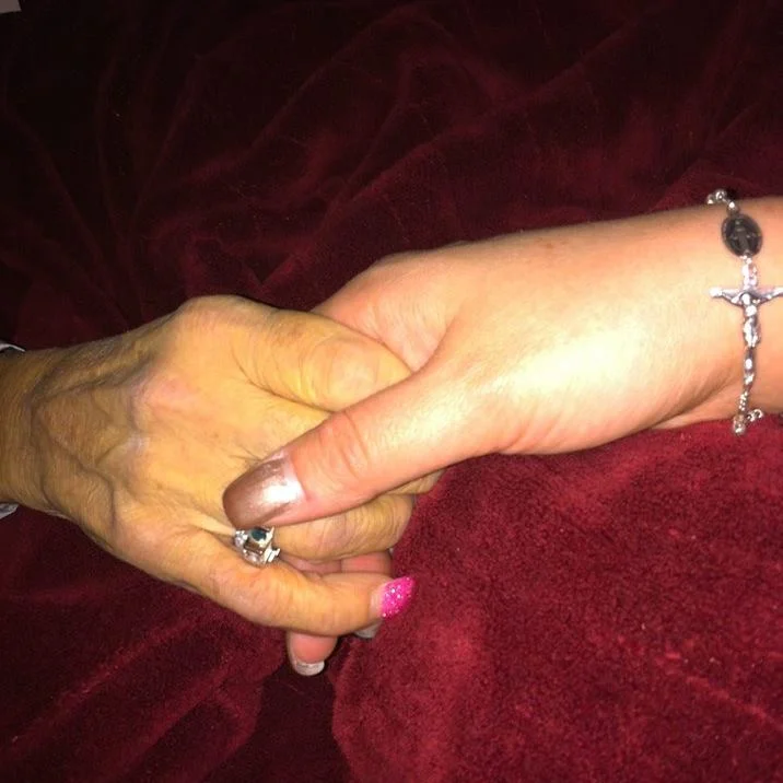 Erin and her mum holding hands