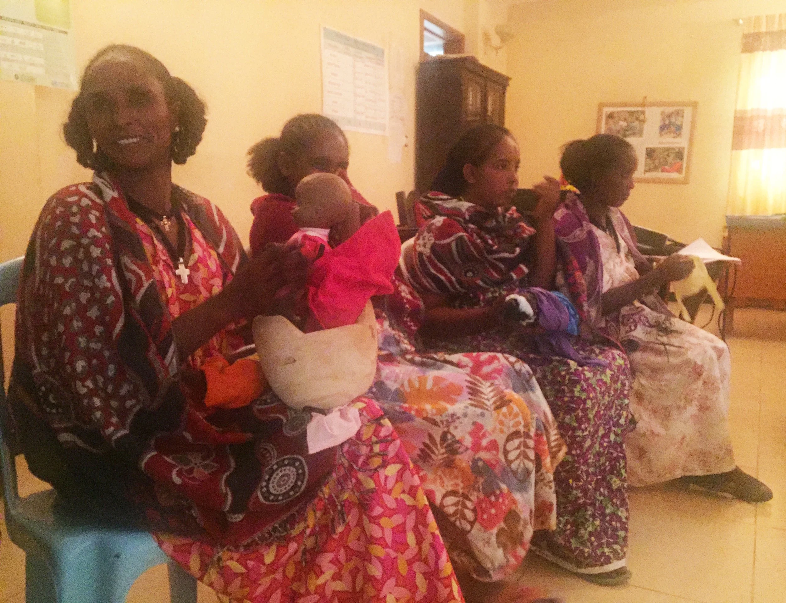 Safe Motherhood Ambassadors from Healing Hands of Joy with educational tools.
